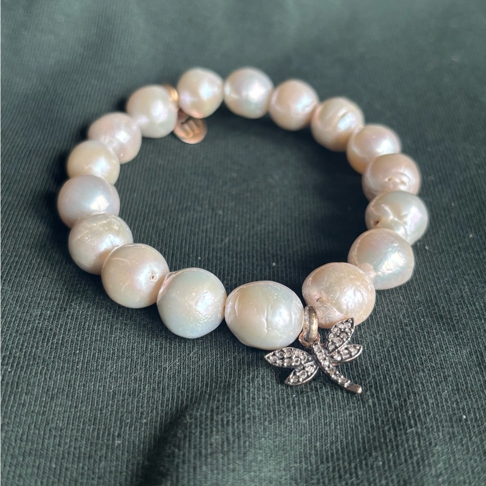 White pearl stretch bracelet with diamond dragonfly charm
